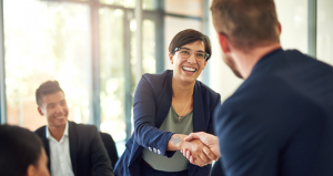 Image of two people shaking hands