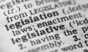 Close up artistic shot of legislation definition in printed dictionary.