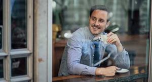 Man drinking cup of coffee
